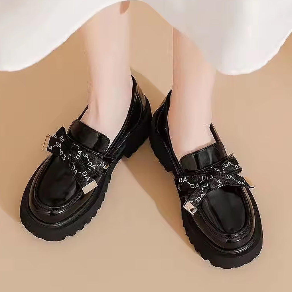 Zwarte plateau loafer met strik voor dames