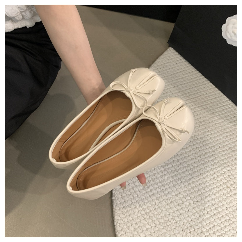 Platte tabi ballerina's met decoratieve strik
