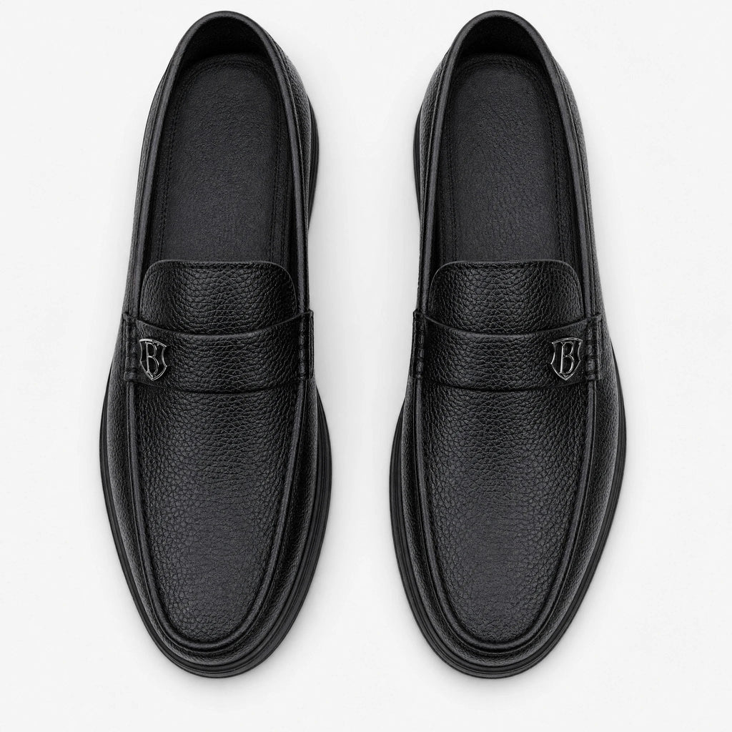 Zwarte heren mocassin met dikke zool, zijaanzicht