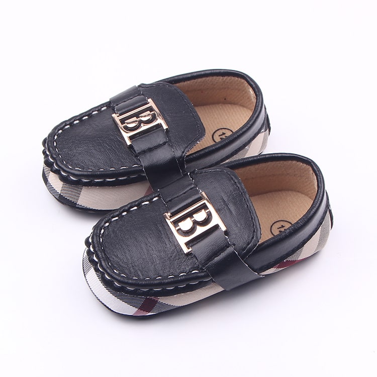 Soepele geklede babyloafers met ruitjespatroon en gouden decoratie
