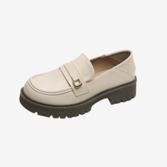 Women's beige platform loafer on grey background